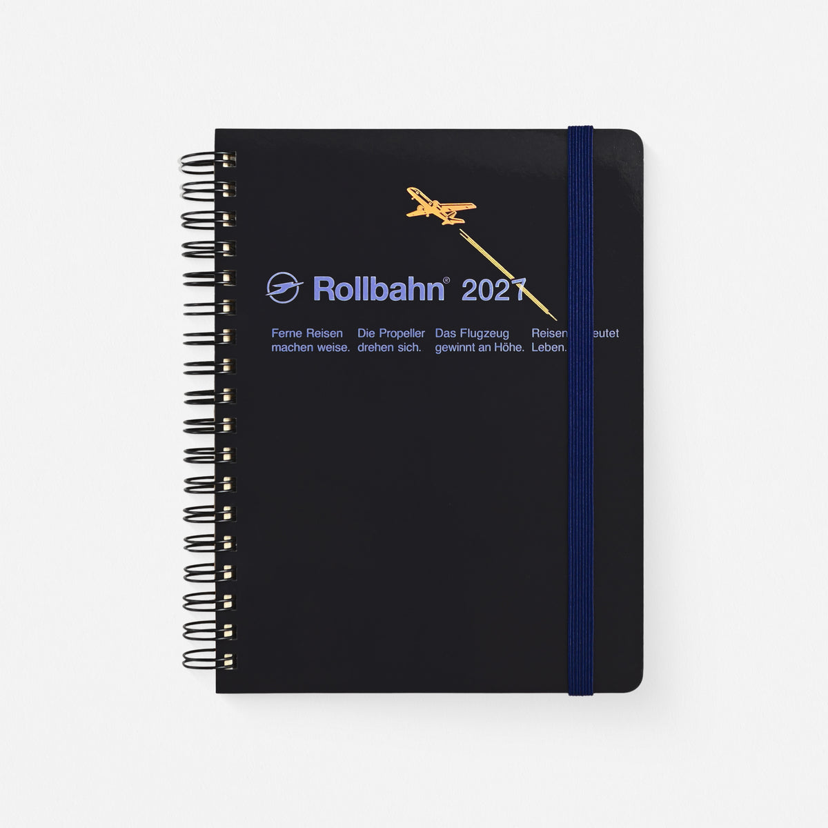 a black 2027 rollbahn plannerr with holographic gold foil plane, sky blue typography, black spiral binding and navy elastic band