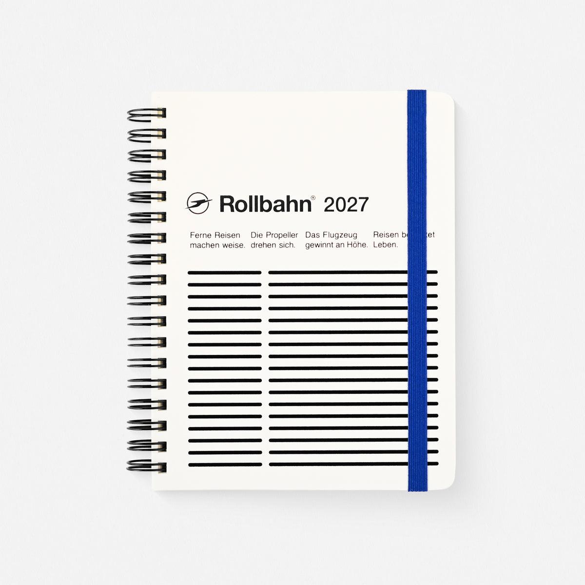 2027 Rollbahn spiral-bound planner. The cover is white with black printed lines, the text 'Rollbahn 2027,' and a vertical blue elastic band.